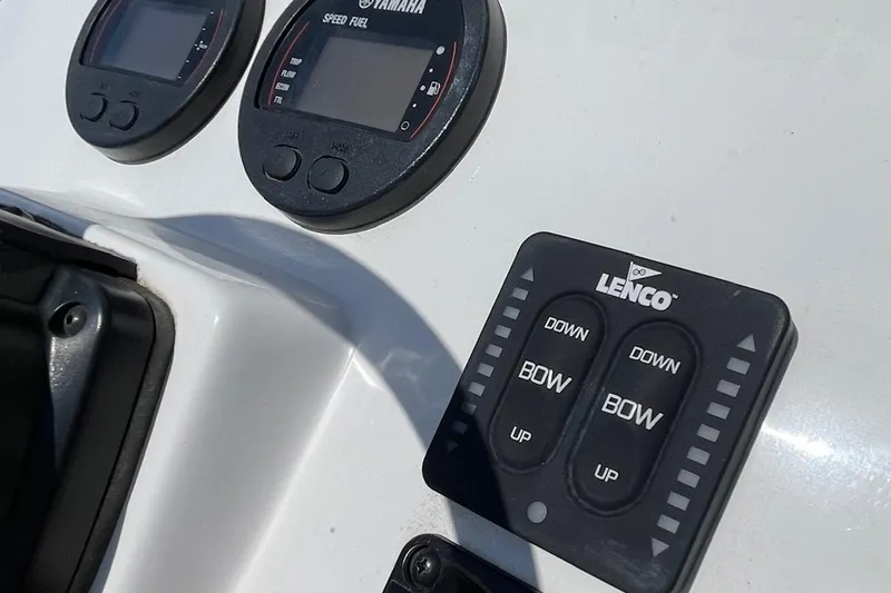 Slide: The Image of Control panel of a 2019 Sea Hunt BX 20 BR boat with Yamaha and Lenco displays. - 24