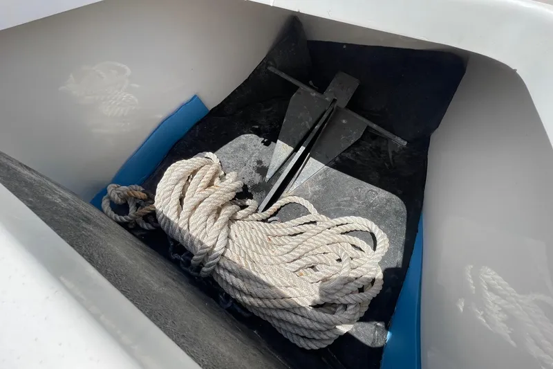 Slide: The Image of 2019 Sea Hunt BX 20 BR anchor compartment with rope and anchor. - 26