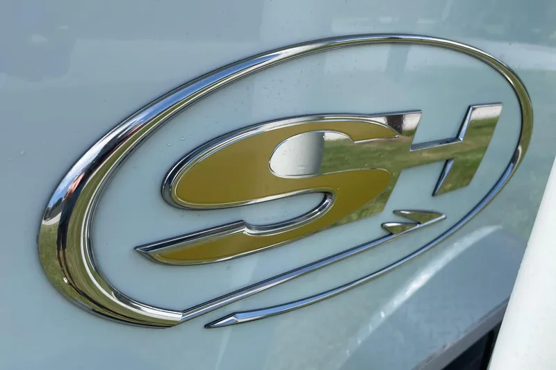 Slide: The Image of Chrome "SH" logo on 2019 Sea Hunt BX 20 BR boat. - 31