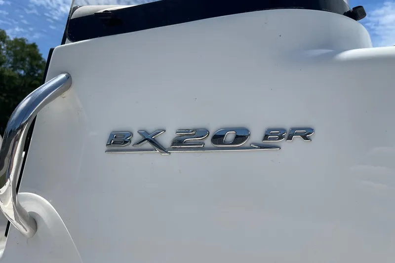 Slide: The Image of 2019 Sea Hunt BX 20 BR boat emblem on white surface, close-up view. - 32