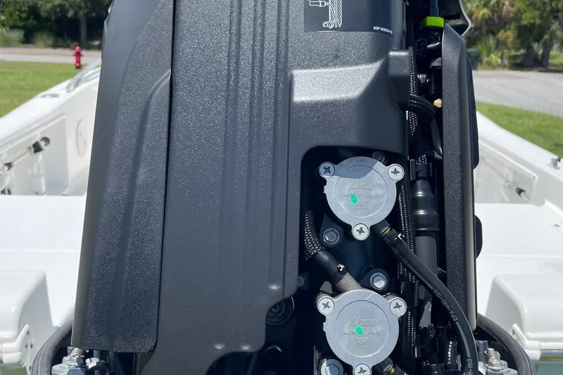 Slide: The Image of Close-up of a 2019 Sea Hunt BX 20 BR boat engine, showcasing intricate components. - 36