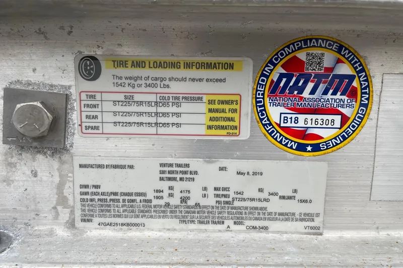 Slide: The Image of 2019 Sea Hunt BX 20 BR tire and loading information label with NATM compliance sticker. - 38