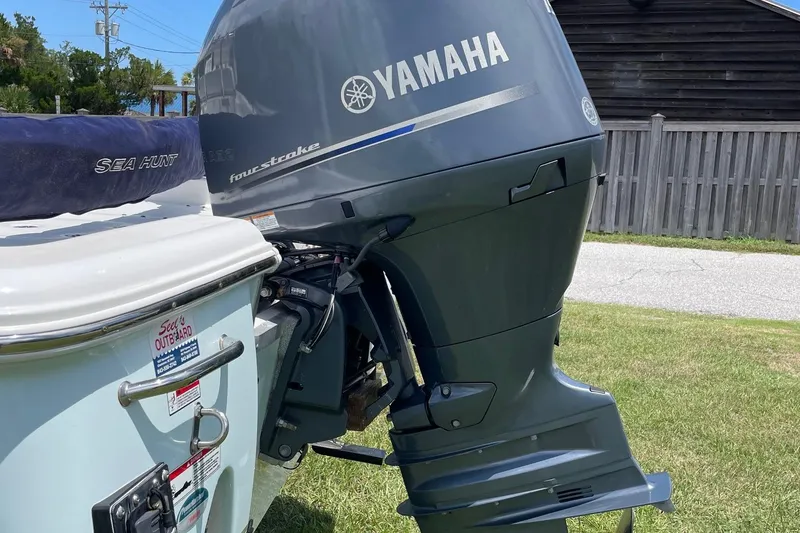 Slide: The Image of 2019 Sea Hunt BX 20 BR boat with Yamaha outboard motor on grassy area. - 6