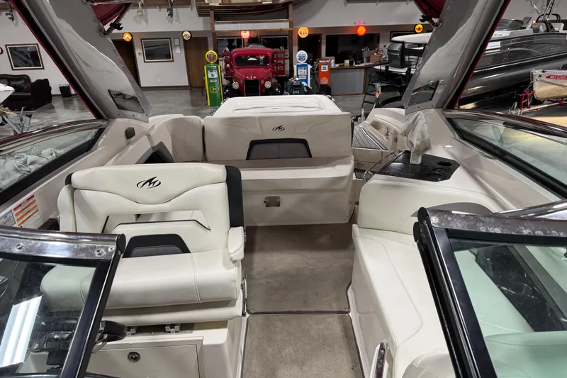 Slide: The Image of Interior of a 2012 Monterey 328 SS Axius boat with white seating and modern design. - 10