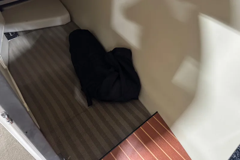 Slide: The Image of Interior cabin of 2012 Monterey 328 SS Axius boat with striped flooring. - 13