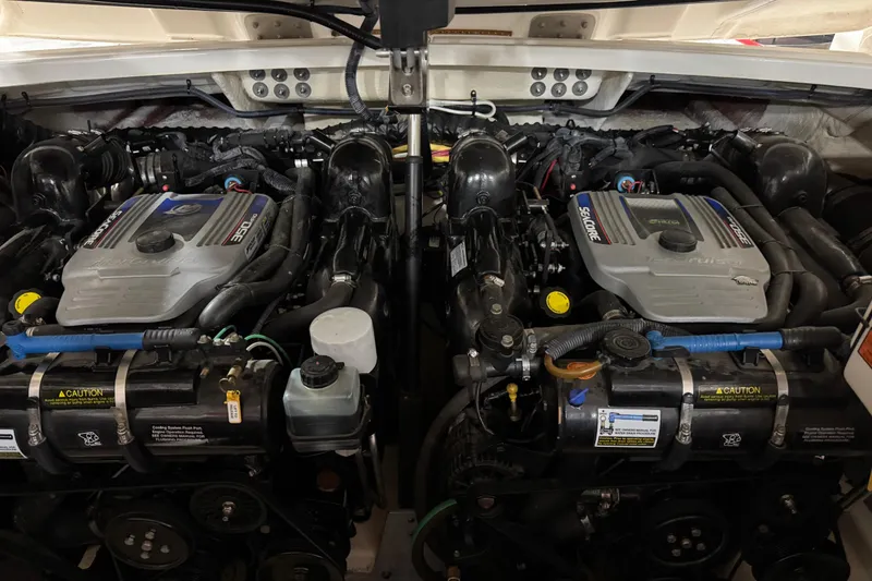 Slide: The Image of Twin engines of a 2012 Monterey 328 SS Axius boat, showcasing detailed mechanical components. - 14