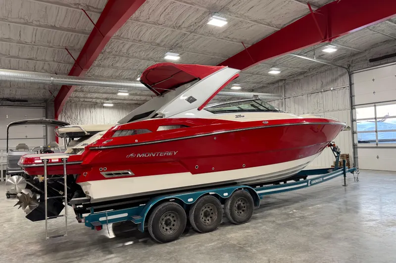 Slide: The Image of 2012 Monterey 328 SS Axius boat in a garage on a trailer. - 4