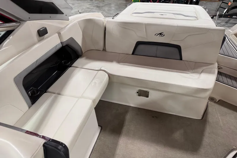 Slide: The Image of 2012 Monterey 328 SS Axius boat interior with white leather seating and cup holders. - 5