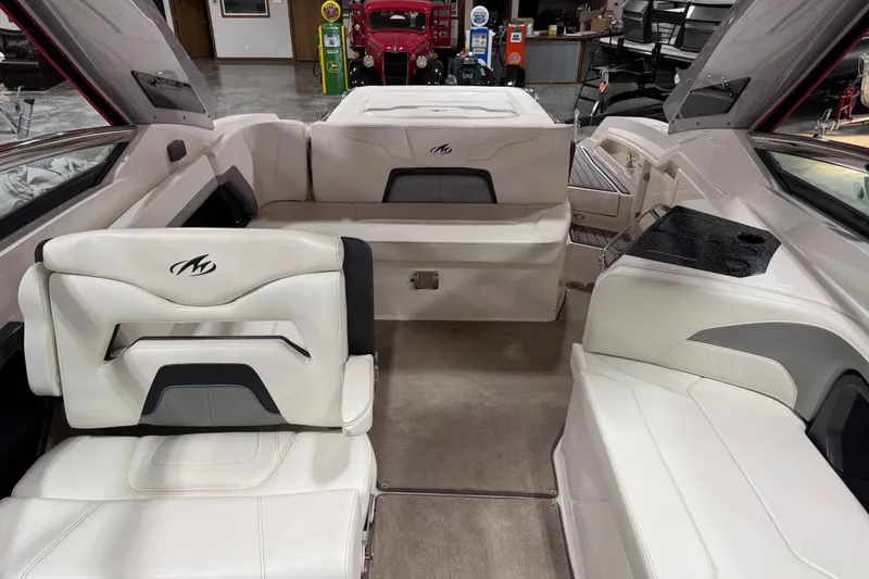 Slide: The Image of Interior of a 2012 Monterey 328 SS Axius boat with white seating and modern design. - 6