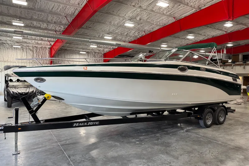 The Image of 2001 Crownline 288 BR boat on trailer in indoor storage facility. - 1