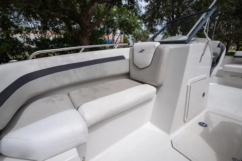 Slide: The Image of 2022 Starcraft SVX 190 DC boat interior with cushioned seating and windshield. - 15