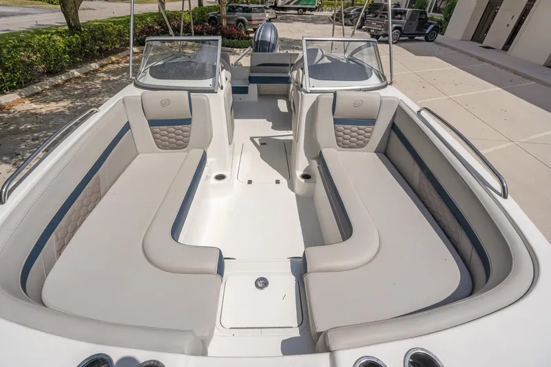 Slide: The Image of 2021 Hurricane SunDeck 217 OB boat interior with spacious seating and modern design. - 13