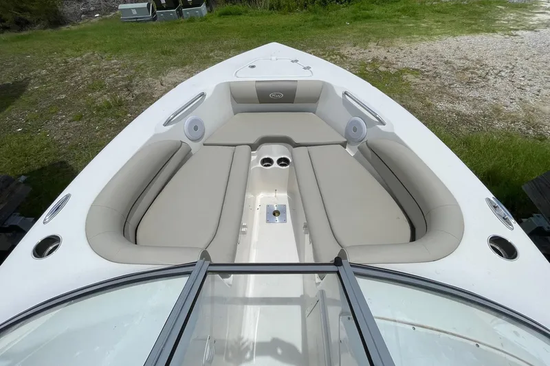Slide: The Image of 2023 Key West 203 DFS boat interior with beige seating and cup holders. - 11