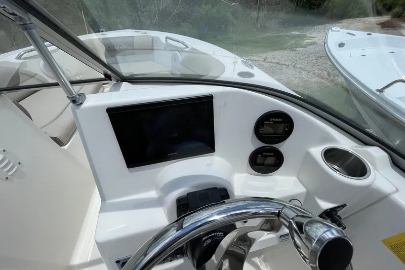Slide: The Image of 2023 Key West 203 DFS boat dashboard with Garmin display and Yamaha controls. - 13