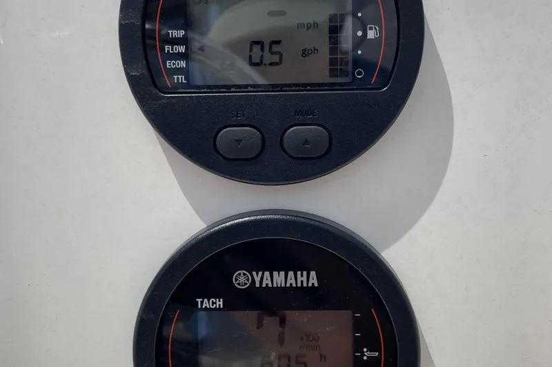 Slide: The Image of Close-up of 2023 Key West 203 DFS boat gauges displaying speed and fuel consumption. - 14
