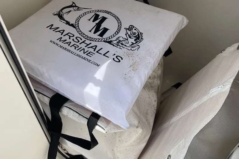 Slide: The Image of Boat storage compartment with Marshall's Marine cushion, Key West 203 DFS, 2023 model. - 21