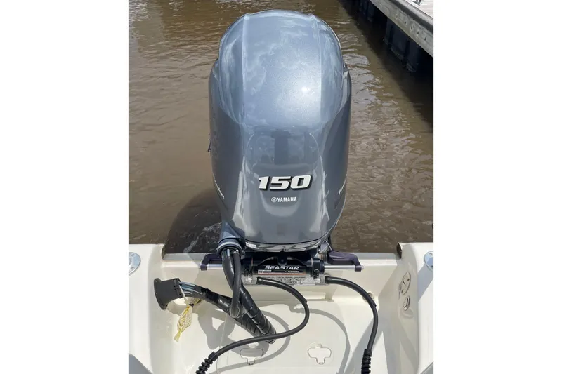 Slide: The Image of 2023 Key West 203 DFS boat with Yamaha 150 outboard motor on water. - 26