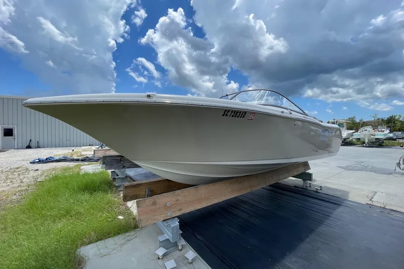 Slide: The Image of 2023 Key West 203 DFS boat on display under cloudy sky. - 6