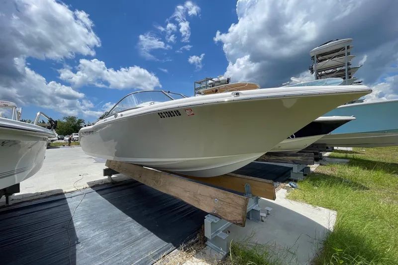 Slide: The Image of 2023 Key West 203 DFS boat on display under a partly cloudy sky. - 7