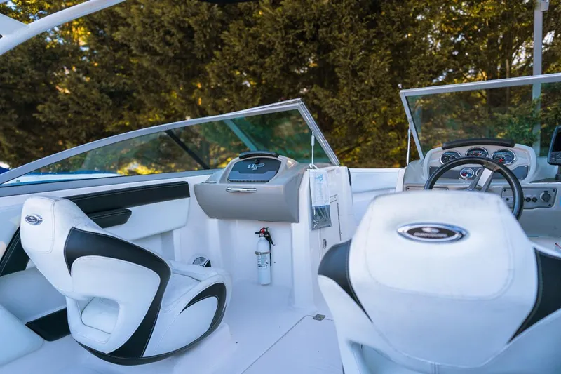 Slide: The Image of 2018 Chaparral 210 Suncoast boat interior with modern dashboard and seating. - 7