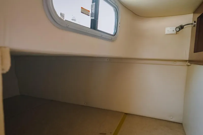 Slide: The Image of 2018 Chaparral 270 Signature cabin interior with window and light fixture. - 5