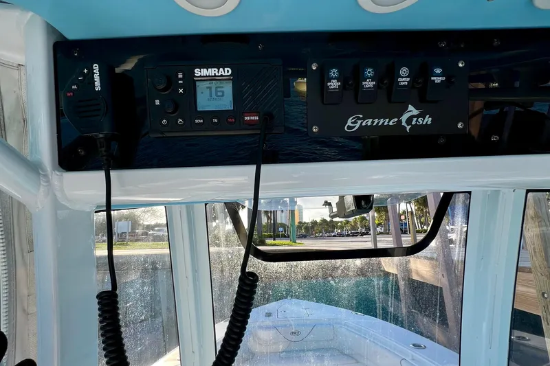 Slide: The Image of Control panel of a 2019 Sea Hunt 27 Gamefish CC boat with Simrad electronics. - 11