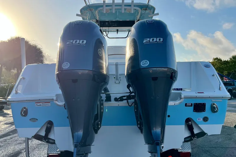 Slide: The Image of 2019 Sea Hunt 27 Gamefish CC with twin Yamaha 200 engines at sunrise. - 14