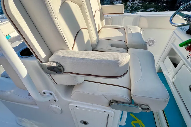Slide: The Image of Luxurious seating on 2019 Sea Hunt 27 Gamefish CC boat, featuring comfortable armrests. - 7
