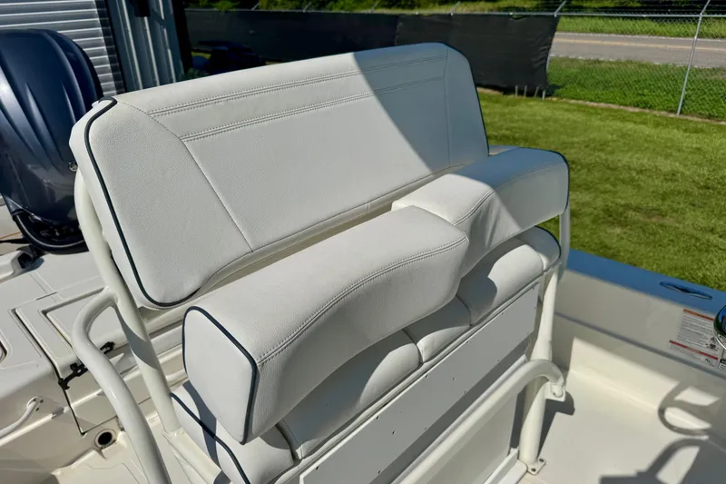 Slide: The Image of 2024 Skeeter SX 241 boat with white cushioned seating, outdoor setting. - 10