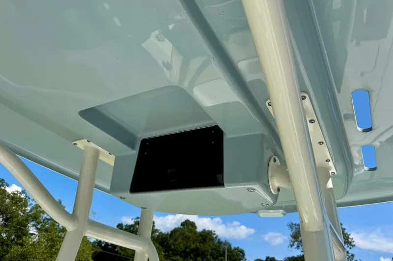 Slide: The Image of 2024 Skeeter SX 241 boat canopy with sturdy support poles and clear blue sky. - 13