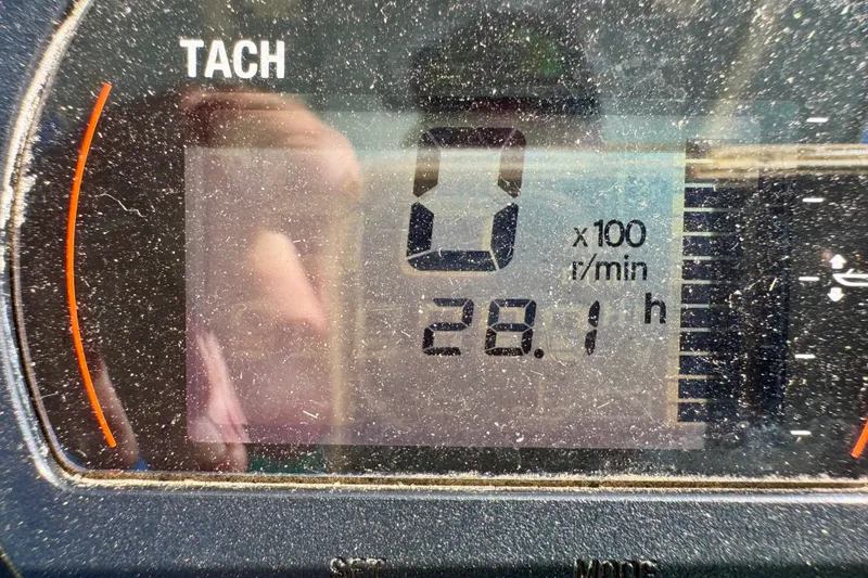 Slide: The Image of 2024 Skeeter SX 241 tachometer displaying 28.1 hours with zero RPM. - 14