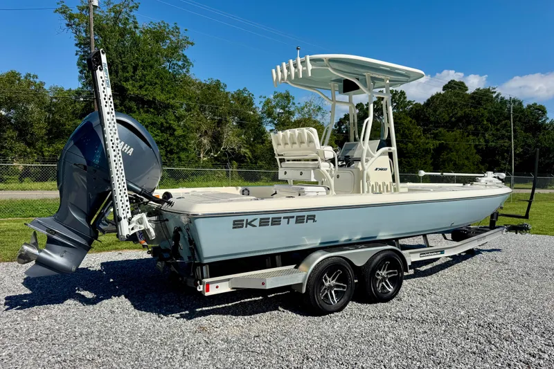 Slide: The Image of 2024 Skeeter SX 241 boat on trailer, featuring Yamaha engine, parked on gravel. - 3