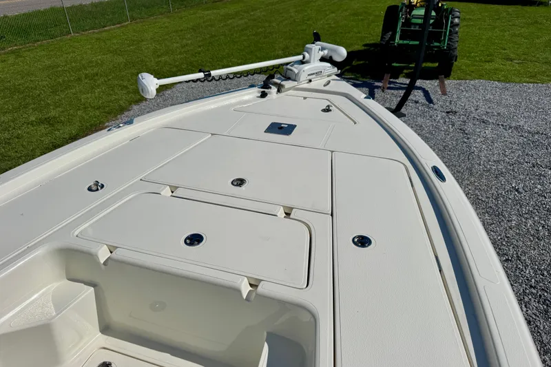 Slide: The Image of 2024 Skeeter SX 241 boat deck with storage compartments and trolling motor. - 6