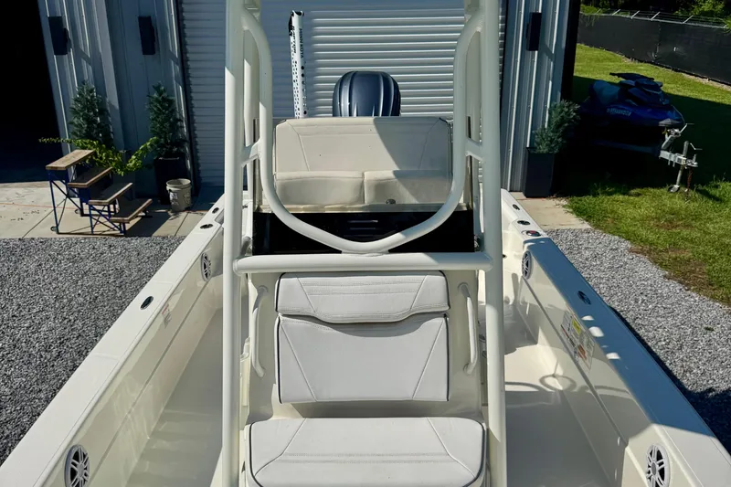 Slide: The Image of 2024 Skeeter SX 241 boat interior with seating and console, parked outdoors. - 7
