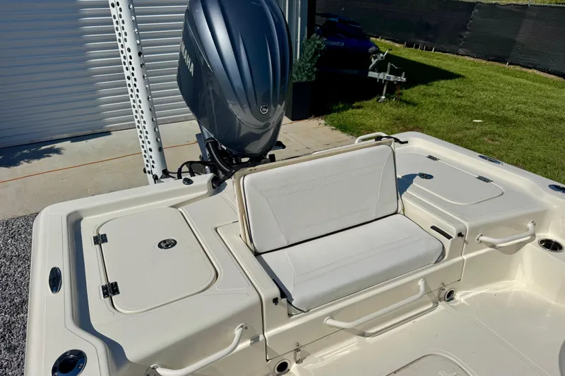 Slide: The Image of 2024 Skeeter SX 241 boat with Yamaha engine, featuring a white seating area and storage compartments. - 8