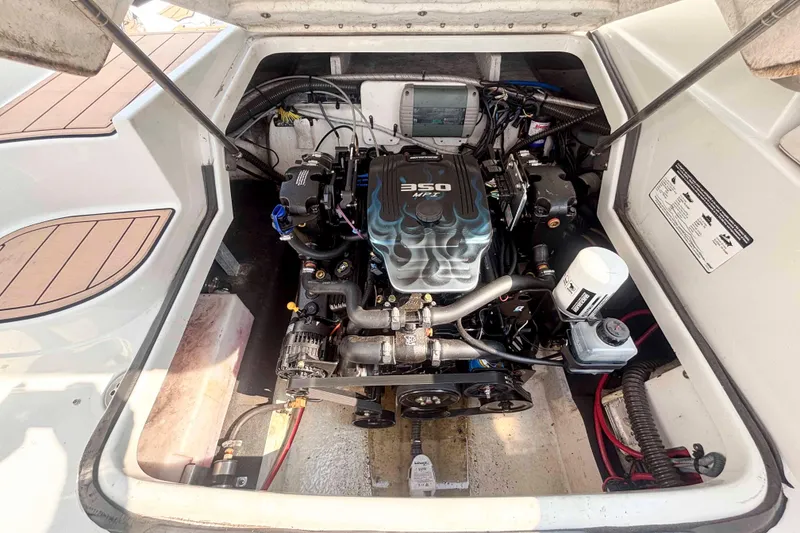 Slide: The Image of Engine compartment of a 2014 Crownline 285 SS boat, featuring a 350 MPI engine. - 16