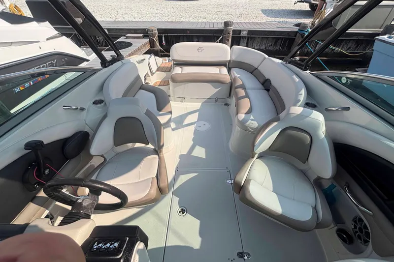 Slide: The Image of 2014 Crownline 285 SS boat interior with spacious seating and modern design. - 6