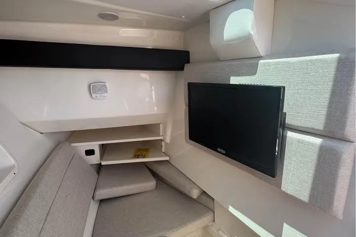 Slide: The Image of Interior cabin of 2019 Sea Ray SLX 350 with TV and seating area. - 10