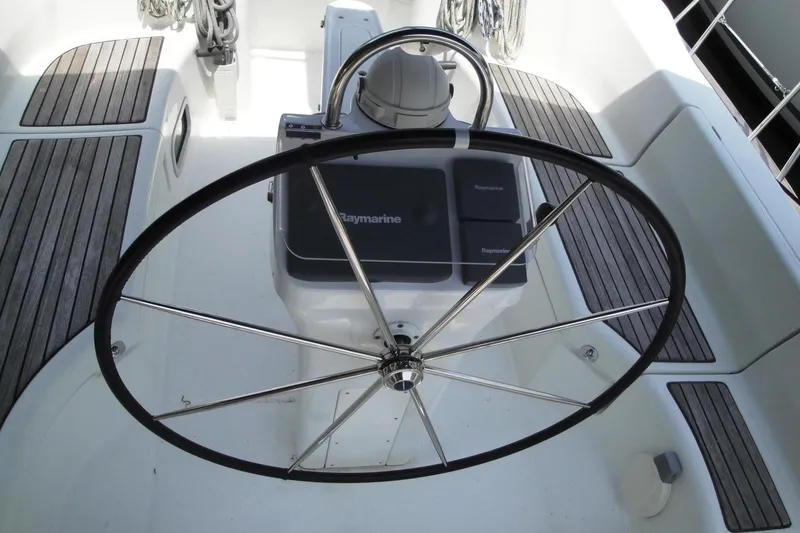 Slide: The Image of Steering wheel of 2006 Beneteau Oceanis Clipper 423 sailboat with Raymarine controls. - 14