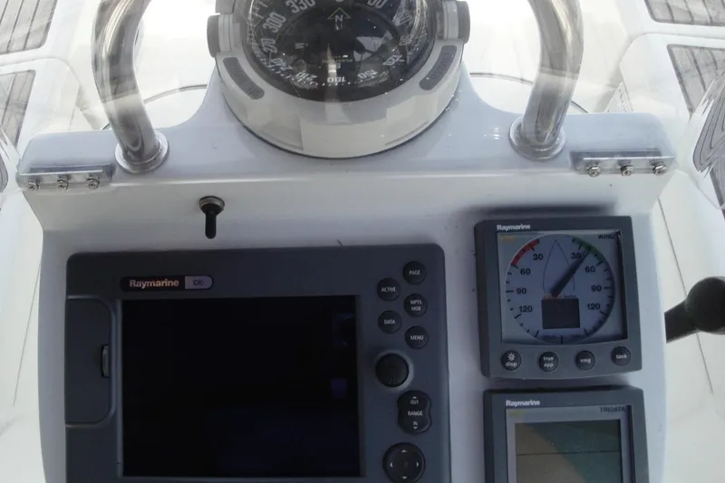 Slide: The Image of Control panel of 2006 Beneteau Oceanis Clipper 423 with compass and Raymarine instruments. - 15
