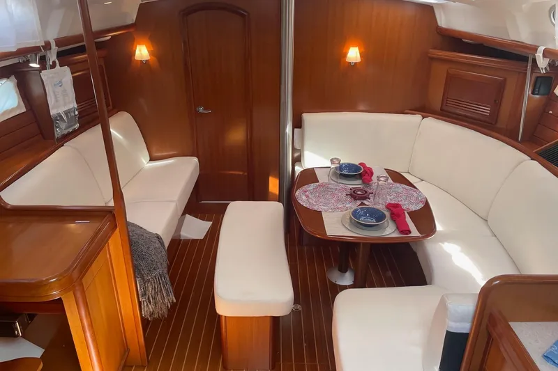 Slide: The Image of Interior of 2006 Beneteau Oceanis Clipper 423 yacht with elegant seating and dining area. - 18