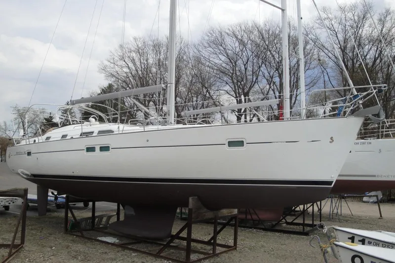 Slide: The Image of 2006 Beneteau Oceanis Clipper 423 sailboat on dry dock, side view. - 2
