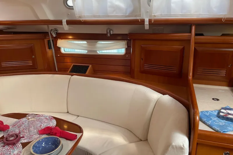 Slide: The Image of Interior of 2006 Beneteau Oceanis Clipper 423 with elegant wood finish and cozy seating. - 20