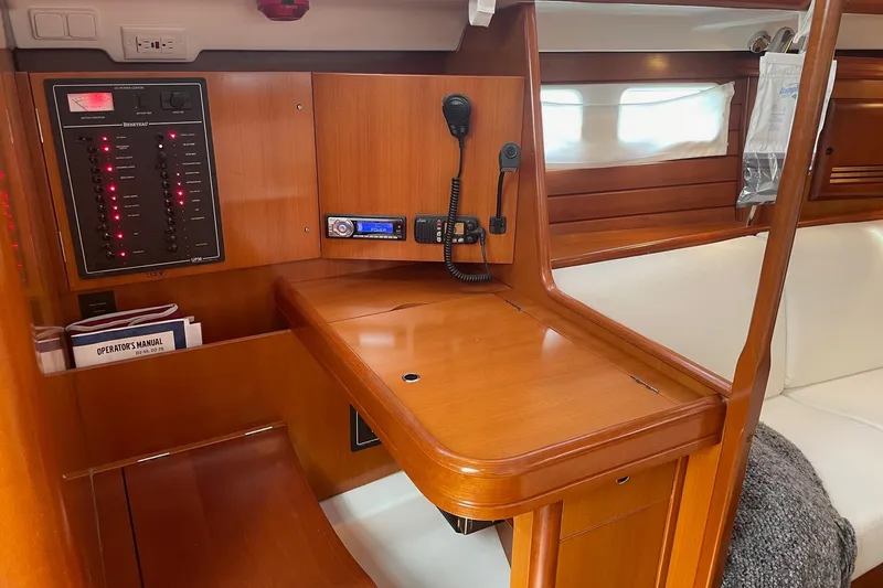 Slide: The Image of Interior of 2006 Beneteau Oceanis Clipper 423 yacht with navigation equipment and wooden finish. - 24
