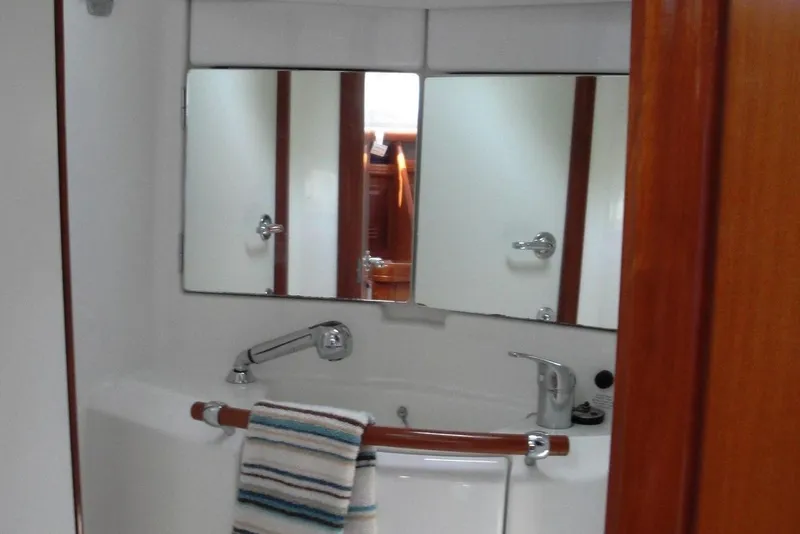 Slide: The Image of Bathroom interior of 2006 Beneteau Oceanis Clipper 423 yacht with mirror and sink. - 29