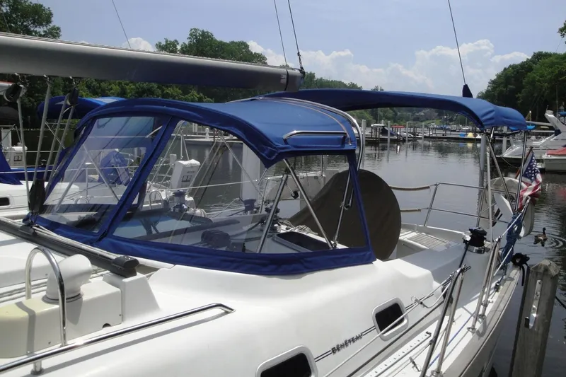 Slide: The Image of 2006 Beneteau Oceanis Clipper 423 sailboat docked with blue canopy. - 5