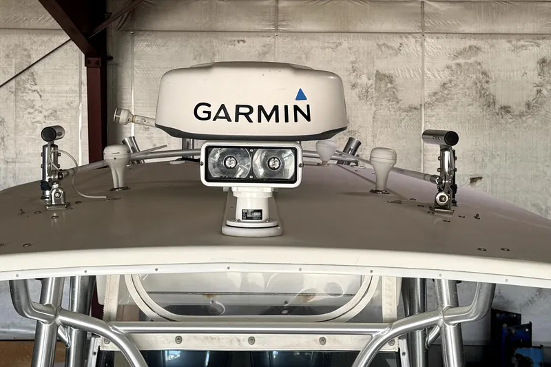 Slide: The Image of 2007 Regulator 32 Forward Seating boat with Garmin radar and lights on the roof. - 11