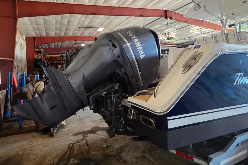 Slide: The Image of 2007 Regulator 32 Forward Seating boat with Yamaha outboard motor in a garage. - 4