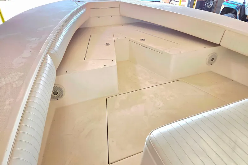 Slide: The Image of 2007 Regulator 32 Forward Seating boat interior with spacious seating and storage compartments. - 6