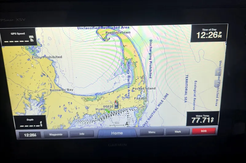 Slide: The Image of Garmin GPS display showing nautical map near Provincetown, with water temperature and time. Regulator 32 Forward Seating, 2007. - 9